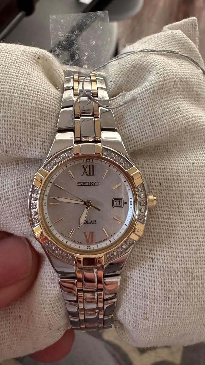 Seiko Sut068 Diamond Solar Watch worn by a model
